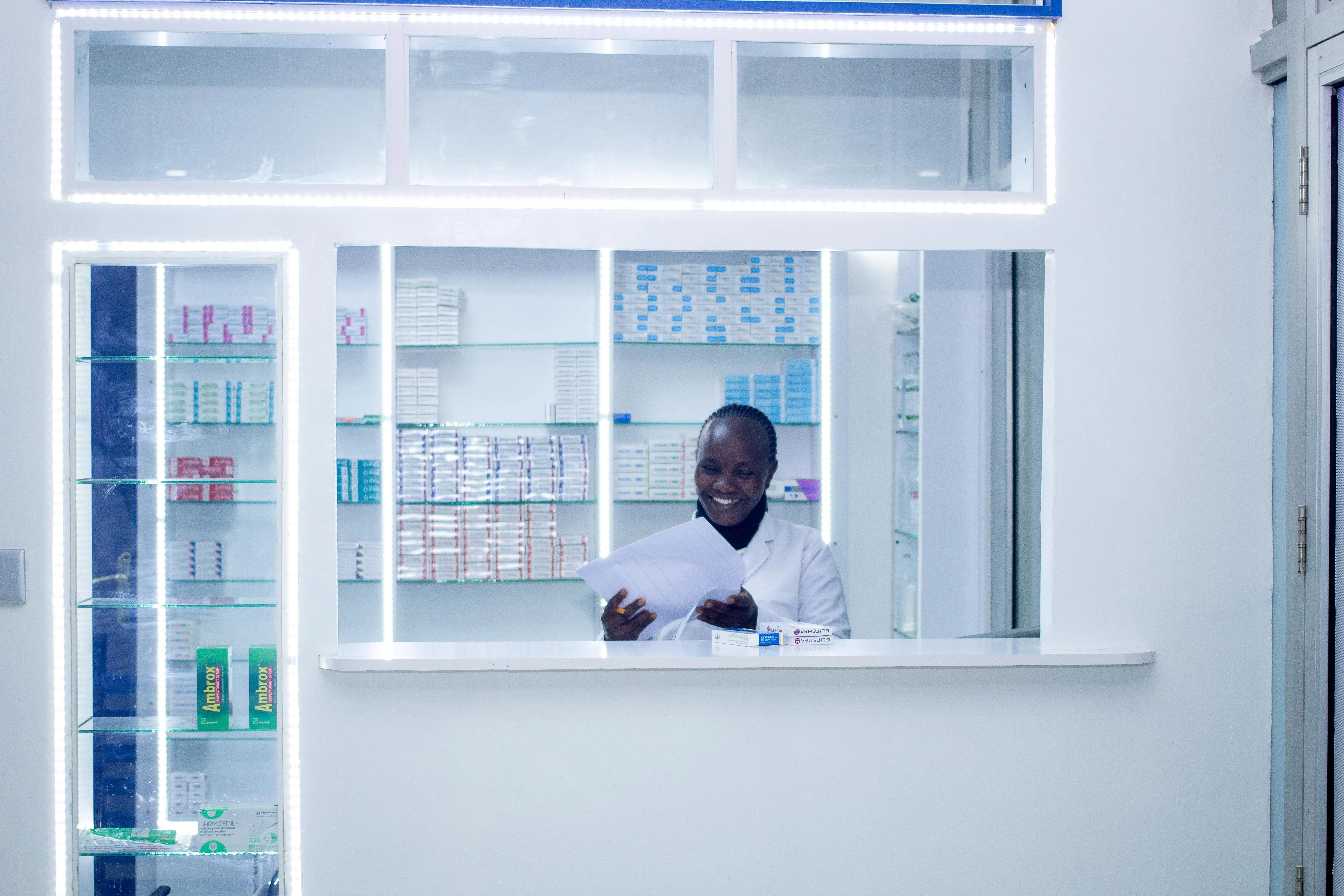Pharmacy counter stocked with medication